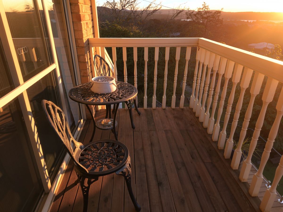 A table and two chairs on the balcony