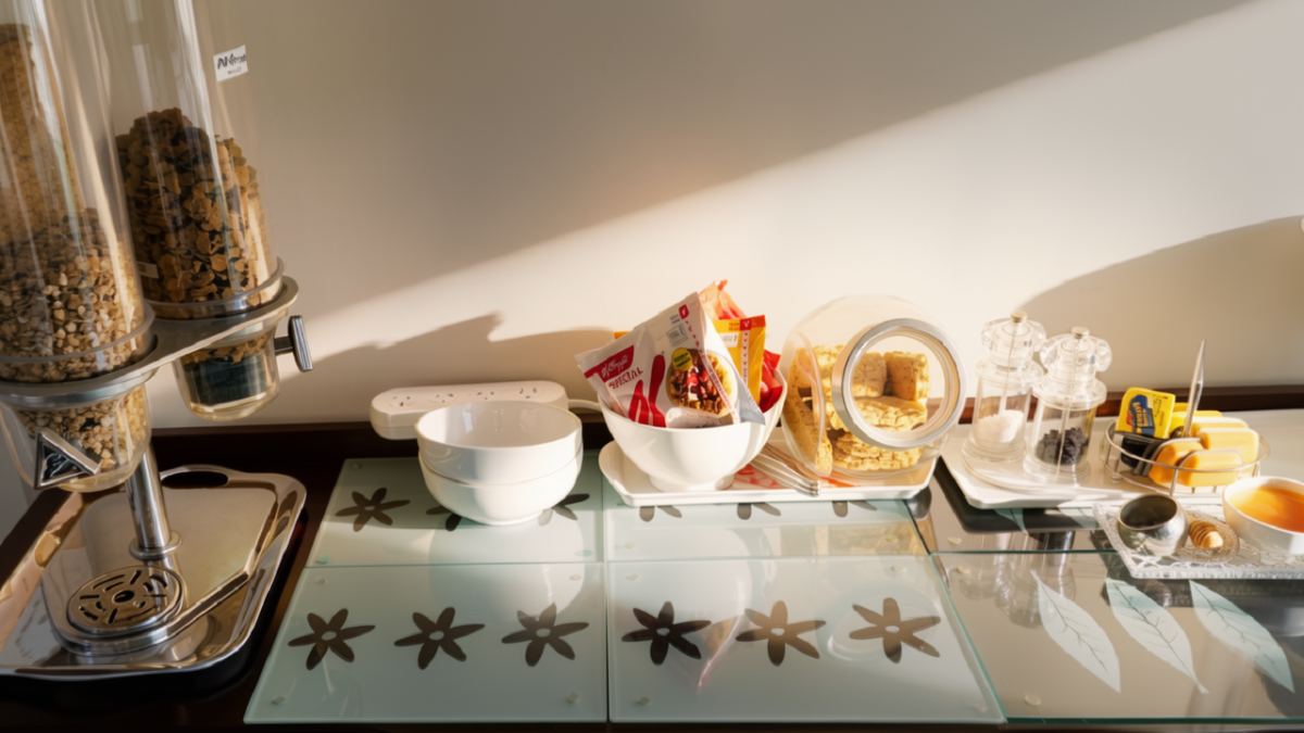 The sideboard — fruit, yoghurt, cereals and the good crystal