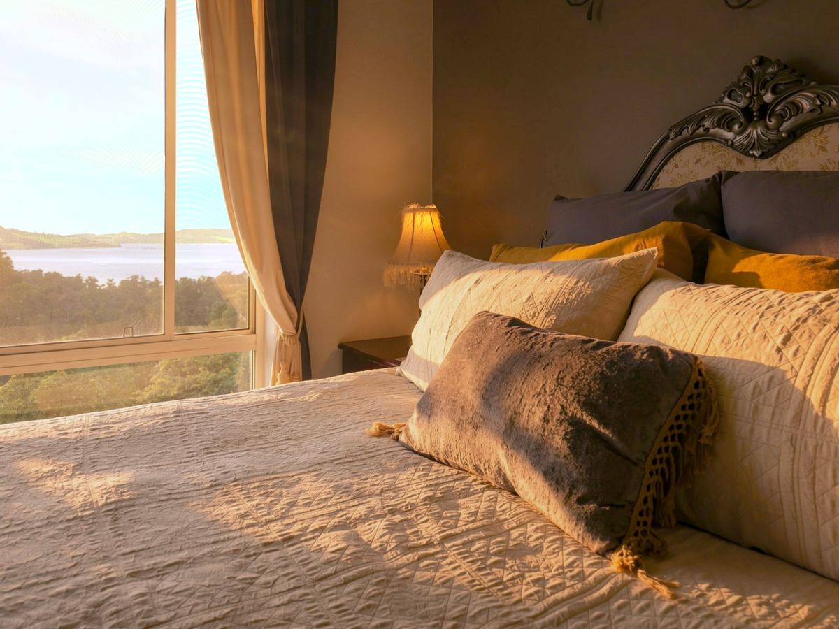 The window at the head of the bed